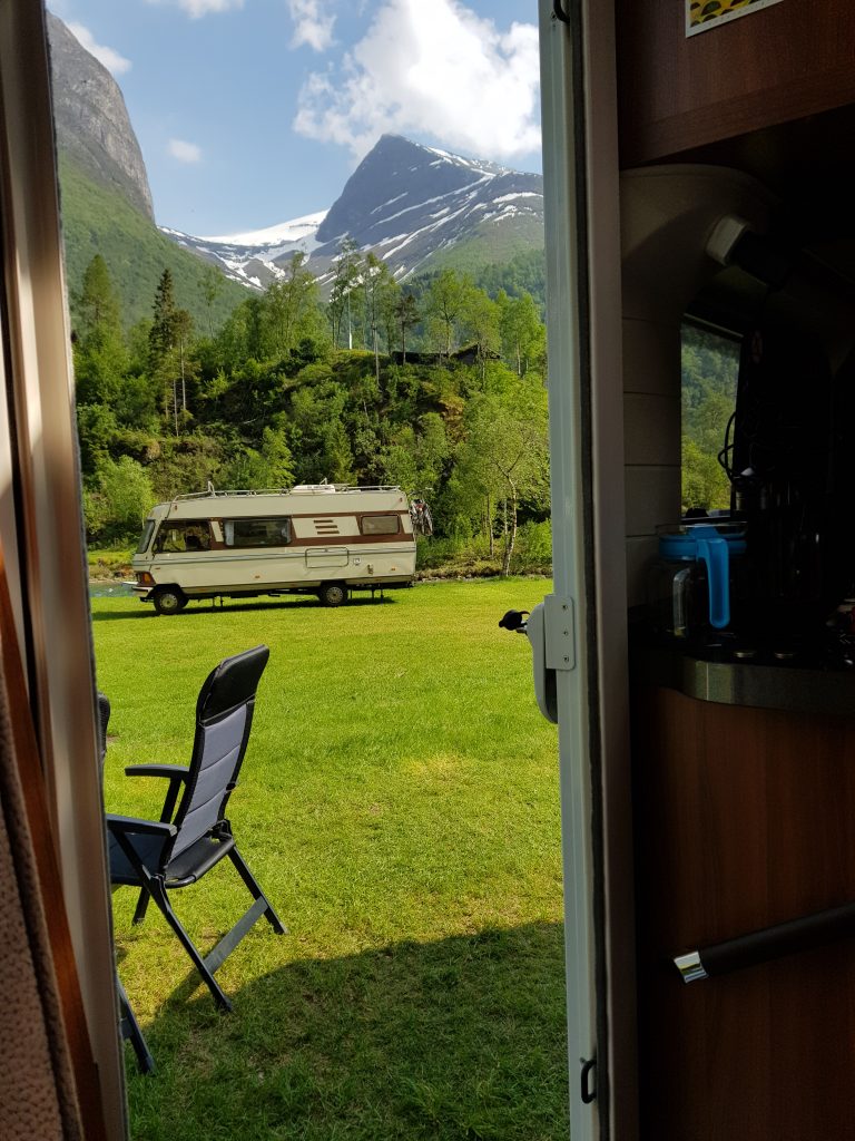 View through our motorhome door at Oldevatn Camping. That's a classic Hymer in the distance.